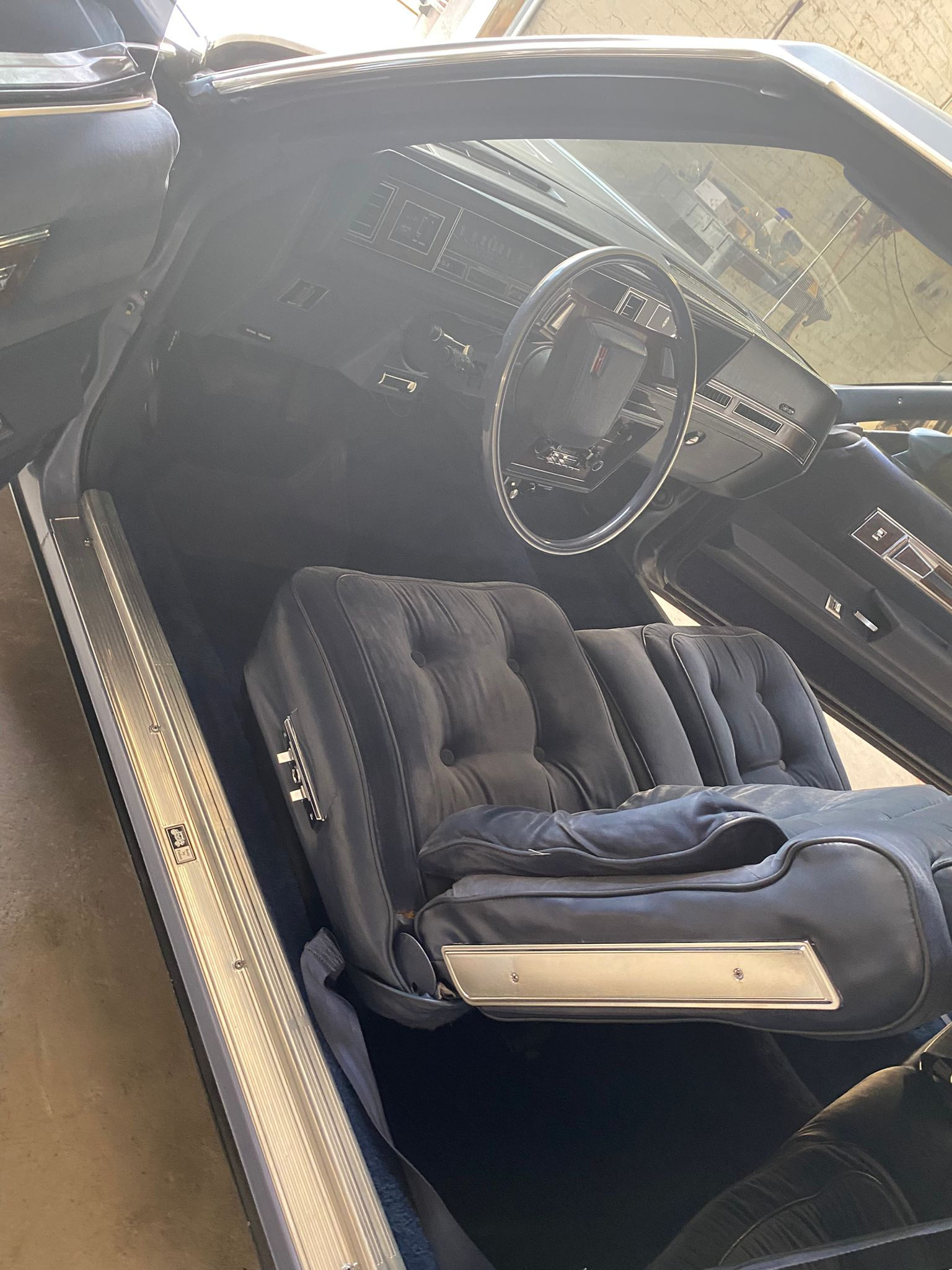 Classic car with blue velour interior details