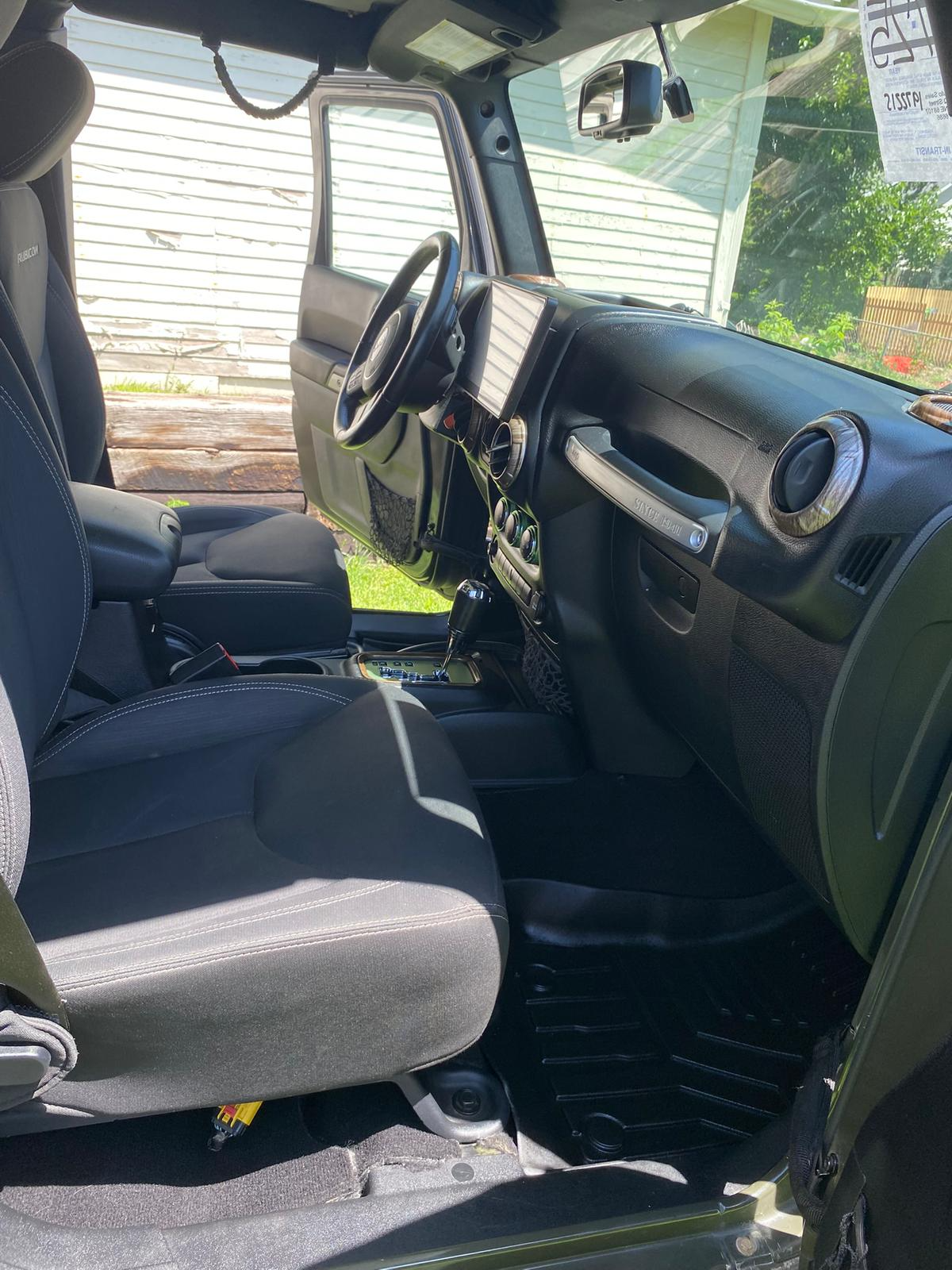 Complete interior of lime green Jeep after detailing