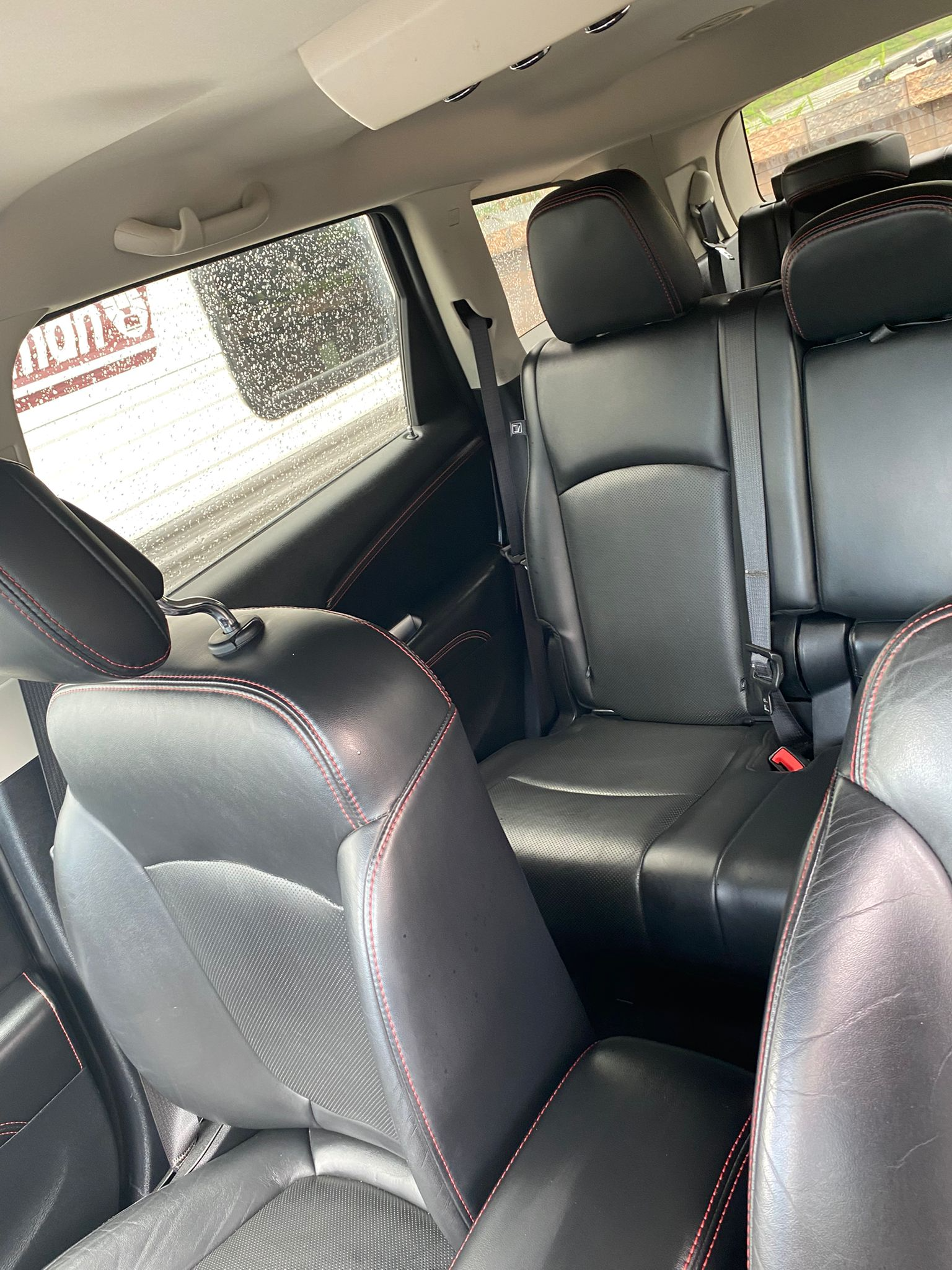 Luxury leather seats with red stitching detail